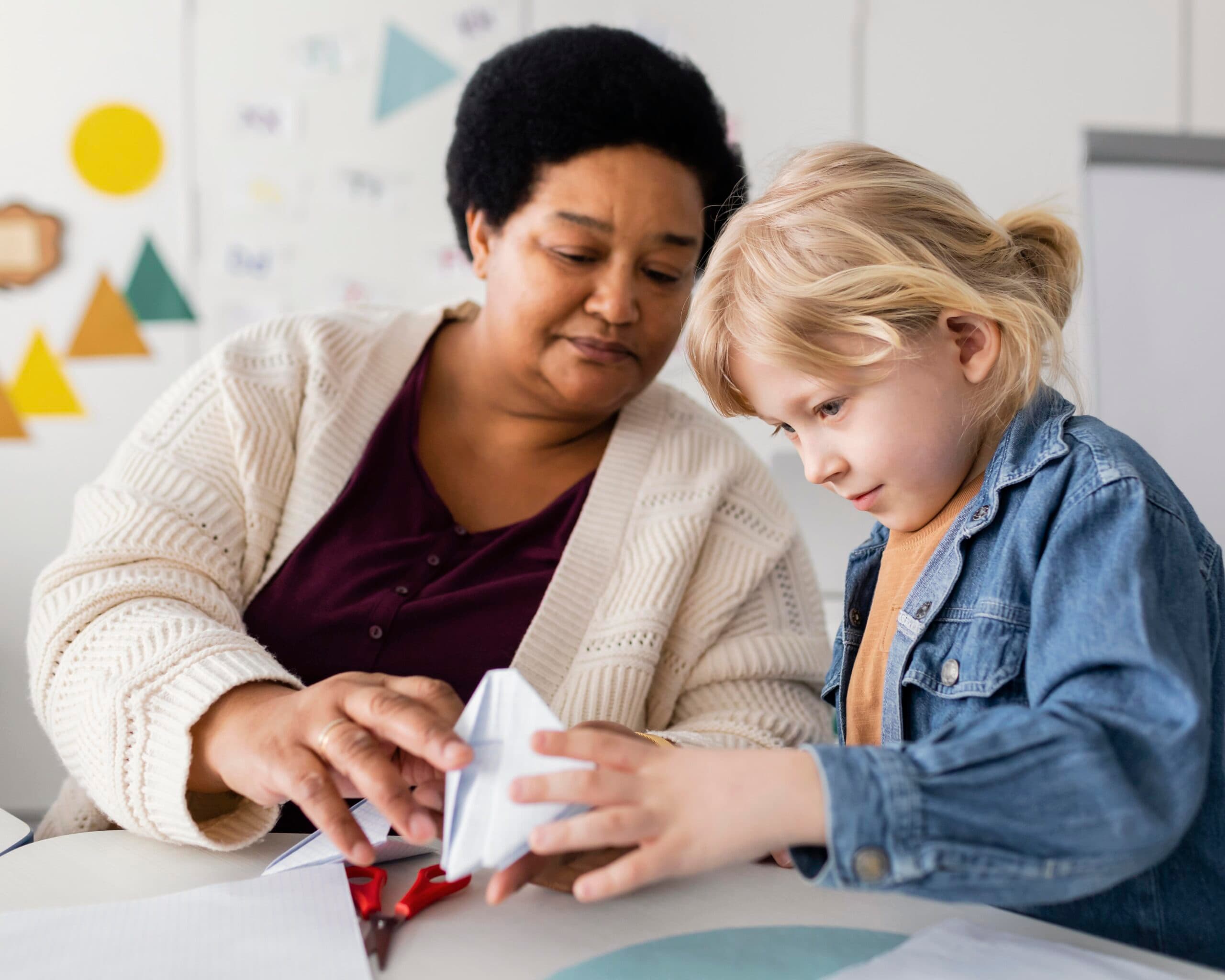 woman-teaching-her-student-origami